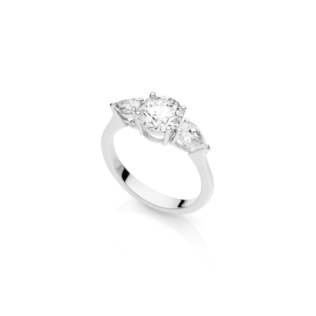 solitaire ring with pear sidestone